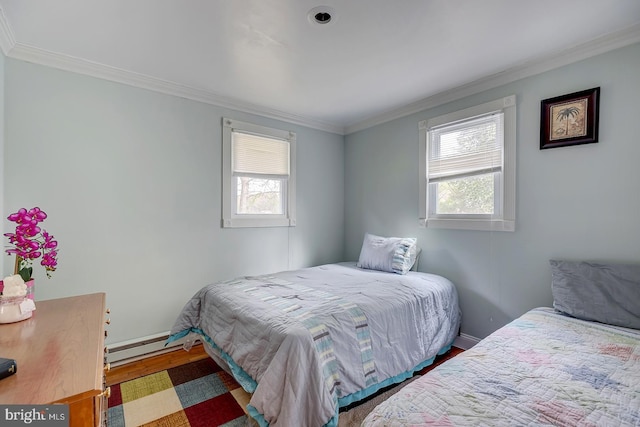 26039 Hidden Acres Ln, Millsboro, DE 19966 - bedroom featuring baseboard heating, multiple windows, crown molding, and wood finished floors