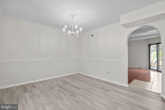3 Bennington Pl, Newtown, PA 18940 - unfurnished dining area featuring baseboards, arched walkways, ornamental molding, a chandelier, and wood finished floors