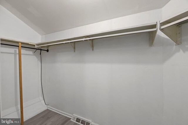 3 Bennington Pl, Newtown, PA 18940 - walk in closet with visible vents, vaulted ceiling, and wood finished floors