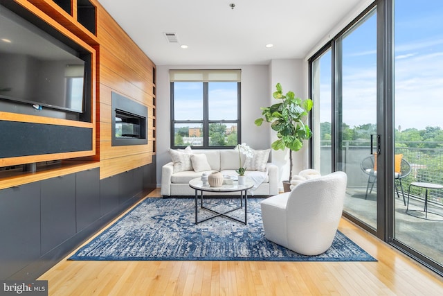3883 Connecticut Ave NW Unit 909, Washington, DC 20008 - living area featuring wood finished floors, wooden walls, and recessed lighting