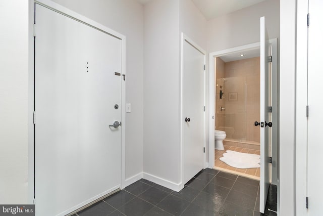 3883 Connecticut Ave NW Unit 909, Washington, DC 20008 - entryway with dark tile patterned floors and baseboards