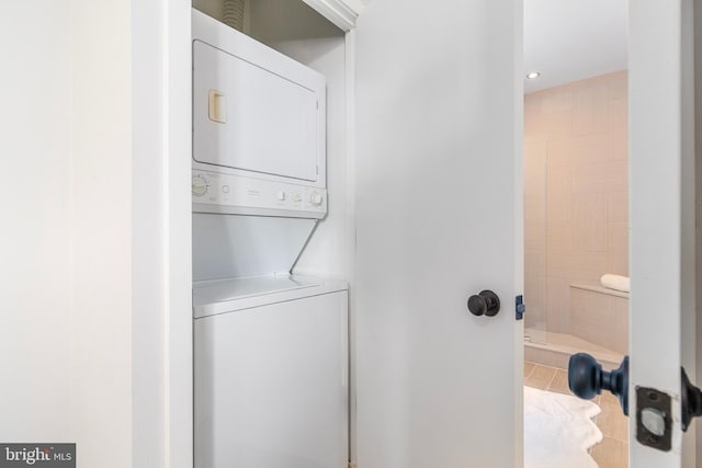 3883 Connecticut Ave NW Unit 909, Washington, DC 20008 - laundry area with estacked washer and dryer, tile patterned flooring, and recessed lighting