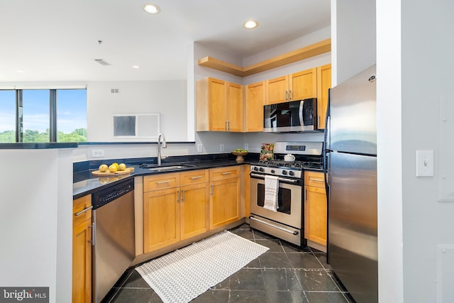 3883 Connecticut Ave NW Unit 909, Washington, DC 20008 - kitchen featuring stainless steel appliances, a sink, dark countertops, and recessed lighting