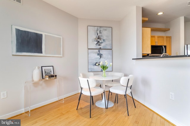 3883 Connecticut Ave NW Unit 909, Washington, DC 20008 - dining room featuring baseboards, light wood-style flooring, and recessed lighting