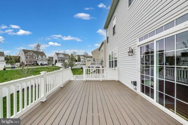 wooden deck featuring a residential view