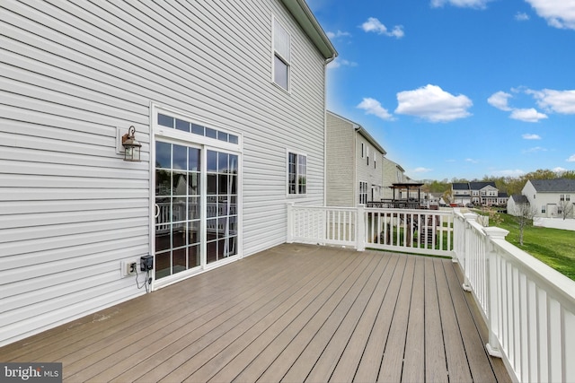 wooden deck featuring a residential view