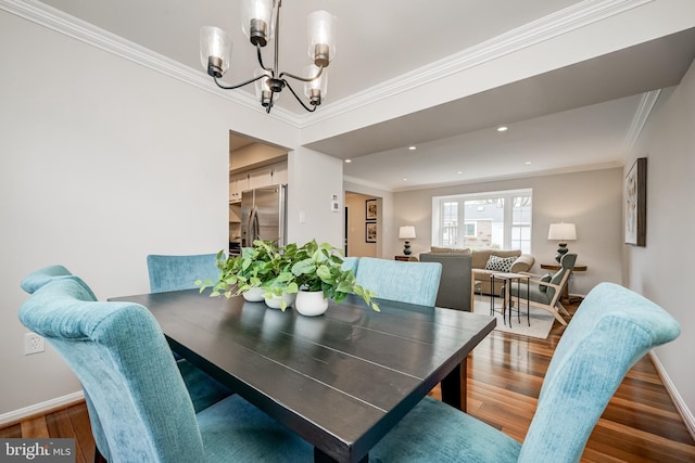 10 Fullview Ct, Gaithersburg, MD 20878 - dining space featuring wood finished floors, crown molding, baseboards, and an inviting chandelier