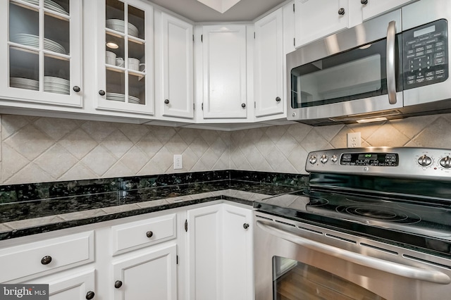 10 Fullview Ct, Gaithersburg, MD 20878 - kitchen featuring white cabinets, glass insert cabinets, dark stone counters, and appliances with stainless steel finishes
