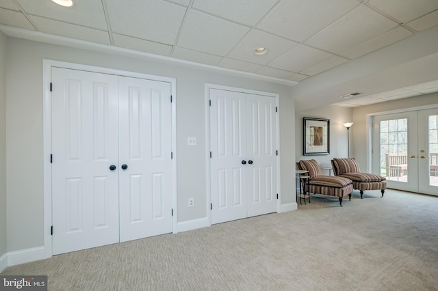 10 Fullview Ct, Gaithersburg, MD 20878 - living area with carpet, visible vents, a paneled ceiling, and french doors