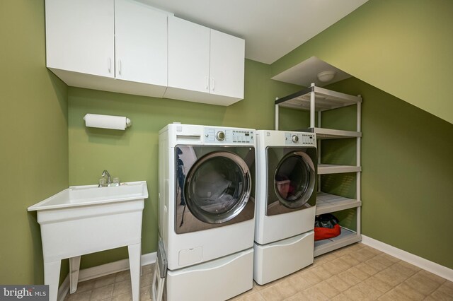 10 Fullview Ct, Gaithersburg, MD 20878 - washroom featuring baseboards, cabinet space, a sink, and independent washer and dryer
