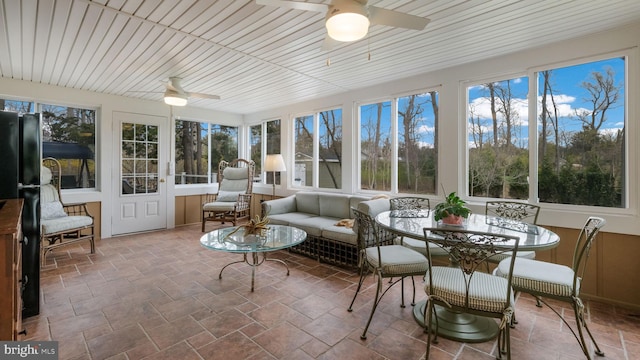 sunroom / solarium with stone finish floor
