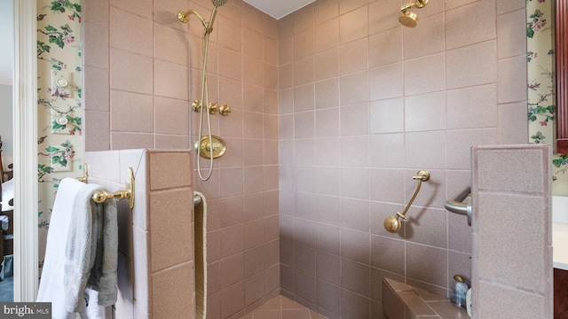 full bath featuring tiled shower