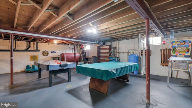 playroom with concrete flooring, billiards, and heating fuel