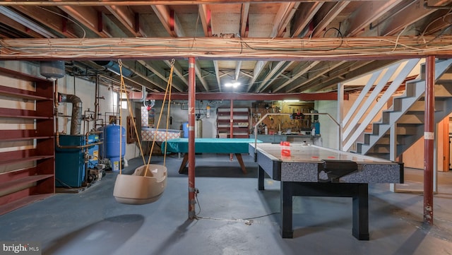 unfinished below grade area with a heating unit and stairway