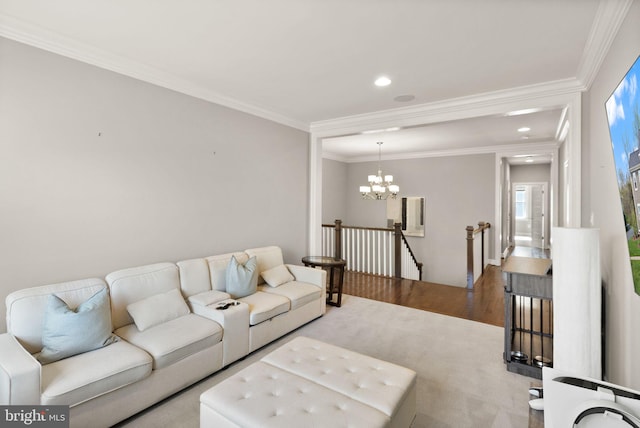 living area featuring a chandelier, recessed lighting, ornamental molding, and wood finished floors
