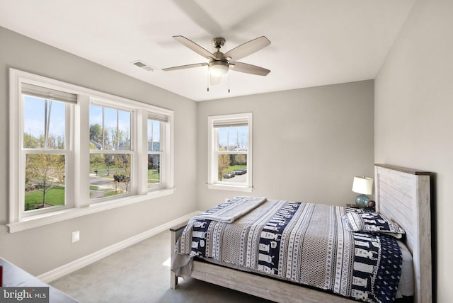 bedroom featuring carpet, visible vents, baseboards, and ceiling fan