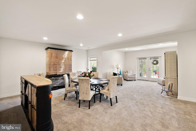 dining space featuring recessed lighting, plenty of natural light, baseboards, and carpet floors