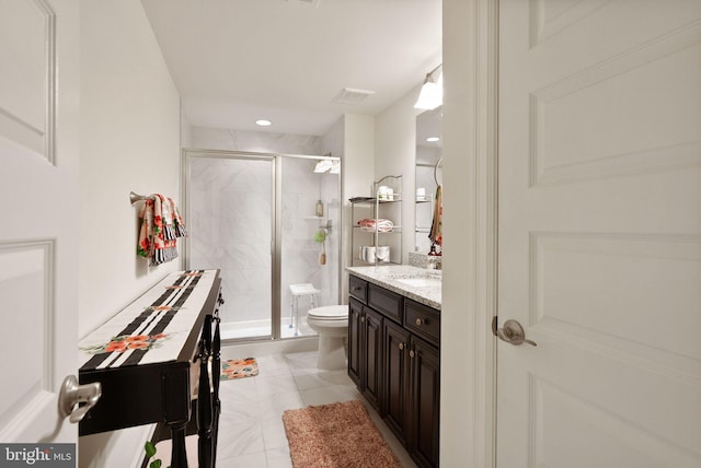 full bath with a shower stall, vanity, visible vents, and toilet