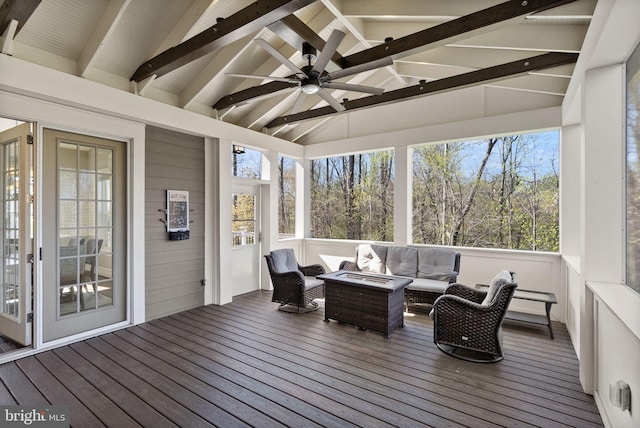 sunroom with outdoor lounge area, beamed ceiling, and ceiling fan