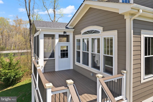 deck with a sunroom