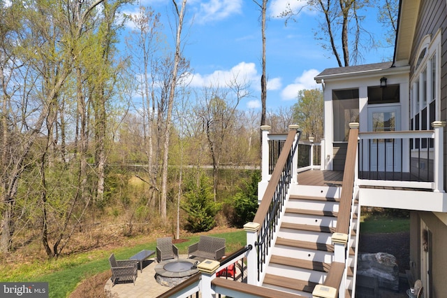 view of yard featuring stairway and a deck