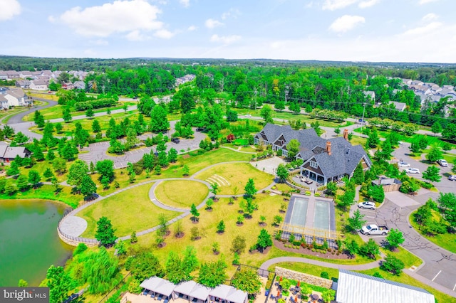 birds eye view of property with a water view and a residential view