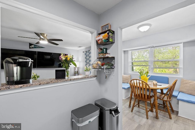 kitchen featuring ceiling fan, wood finished floors, and visible vents
