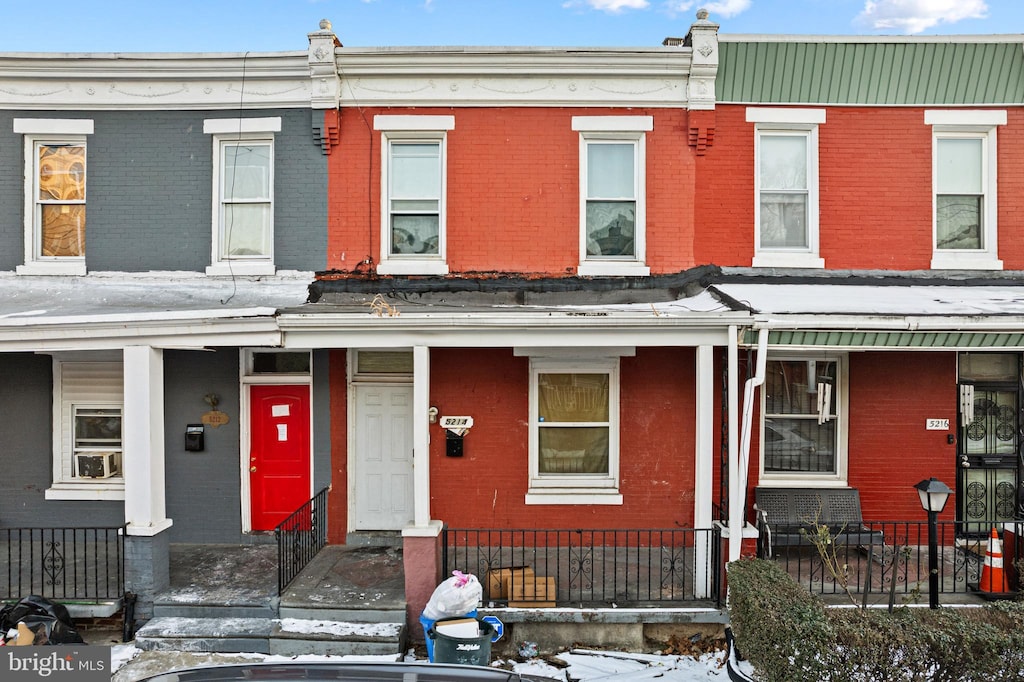 5214 W Stiles St, Philadelphia, PA 19131 - multi unit property with brick siding, covered porch, and a fenced front yard