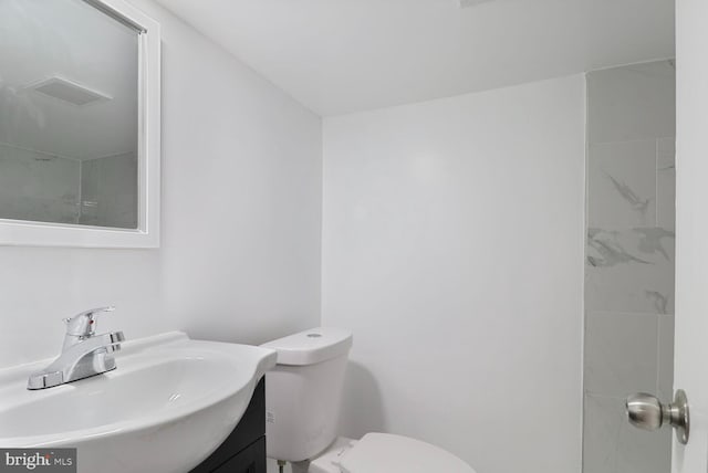 1820 Aiken St, Baltimore, MD 21213 - bathroom with visible vents, toilet, and vanity