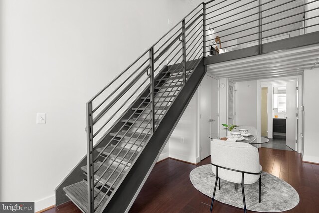 1401 R St NW Unit 304, Washington, DC 20009 - staircase with baseboards, a towering ceiling, and wood finished floors