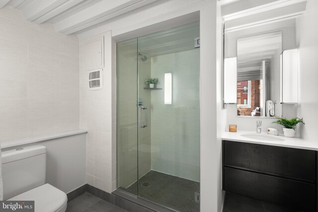 1401 R St NW Unit 304, Washington, DC 20009 - bathroom with vanity, tile patterned floors, a shower stall, and toilet