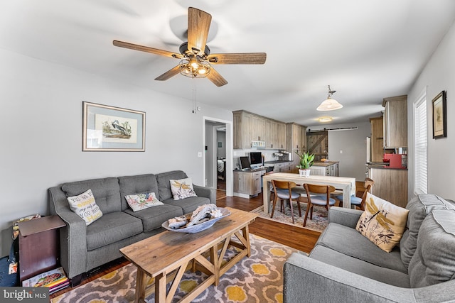 129 Prince Georges Dr, Dagsboro, DE 19939 - living room featuring a ceiling fan, wood finished floors, and a barn door