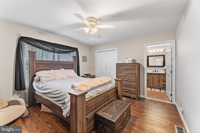 129 Prince Georges Dr, Dagsboro, DE 19939 - bedroom featuring wood finished floors, visible vents, a sink, a closet, and baseboards
