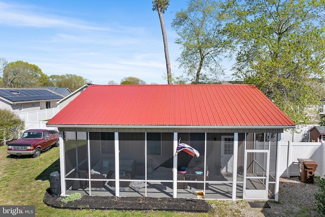 129 Prince Georges Dr, Dagsboro, DE 19939 - back of house with a sunroom, metal roof, and fence