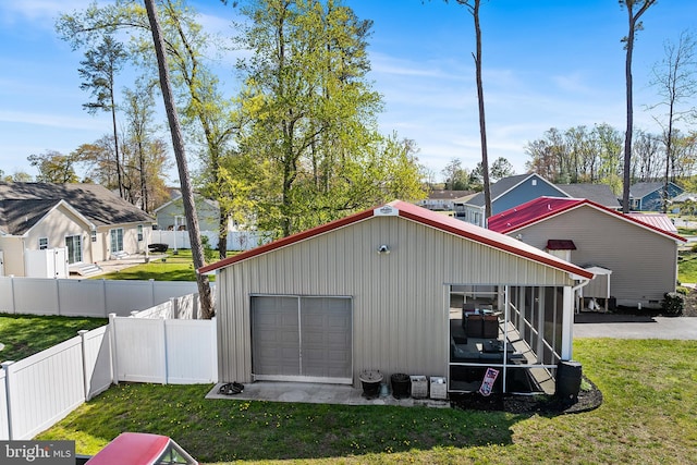 129 Prince Georges Dr, Dagsboro, DE 19939 - detached garage featuring fence and a residential view