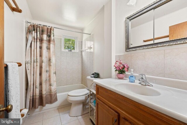 bathroom with toilet, shower / bathtub combination with curtain, tile patterned flooring, and vanity