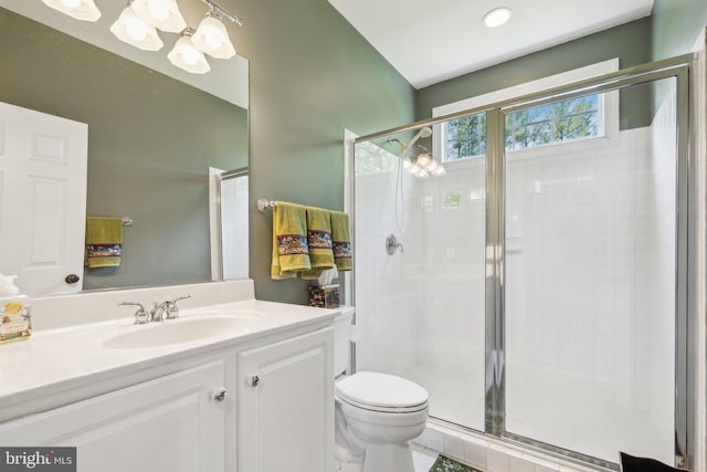 full bathroom with vanity, toilet, and a stall shower