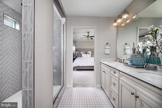 full bathroom featuring wallpapered walls, double vanity, a sink, and ensuite bath