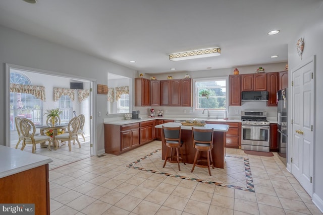 113 Anna Ct, Middletown, DE 19709 - kitchen featuring a kitchen breakfast bar, a center island, light countertops, stainless steel appliances, and recessed lighting