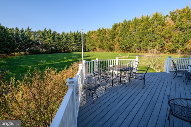 113 Anna Ct, Middletown, DE 19709 - wooden terrace featuring outdoor dining area, a yard, and a forest view