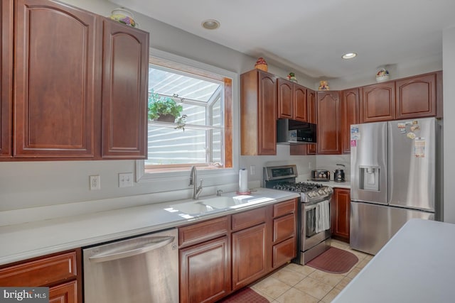 113 Anna Ct, Middletown, DE 19709 - kitchen featuring light countertops, appliances with stainless steel finishes, light tile patterned floors, and a sink