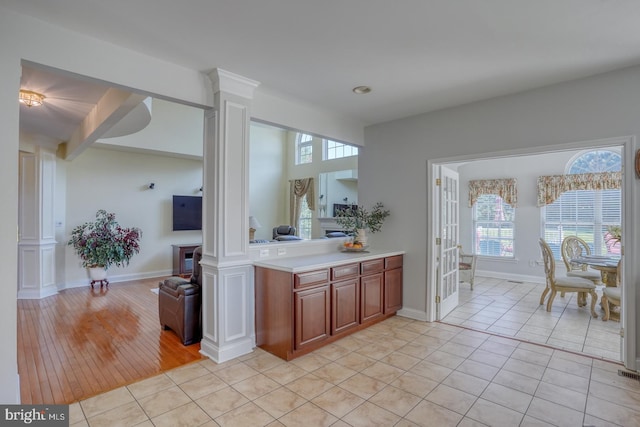 113 Anna Ct, Middletown, DE 19709 - kitchen featuring ornate columns, light countertops, baseboards, and light tile patterned floors