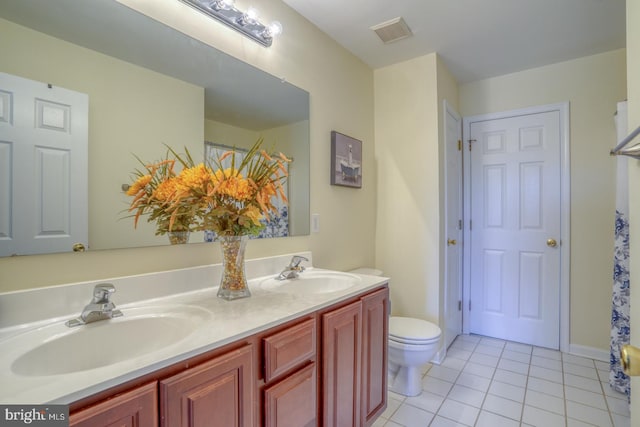 113 Anna Ct, Middletown, DE 19709 - bathroom featuring visible vents, a sink, tile patterned flooring, and double vanity