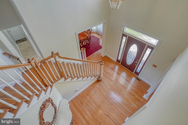 113 Anna Ct, Middletown, DE 19709 - entryway with a healthy amount of sunlight, baseboards, wood finished floors, and a towering ceiling