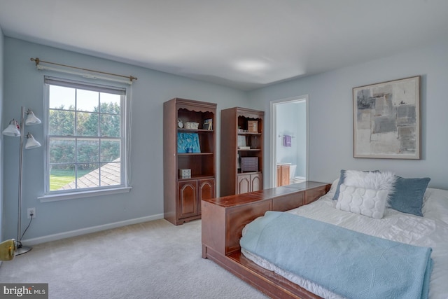113 Anna Ct, Middletown, DE 19709 - bedroom with baseboards, ensuite bath, and light colored carpet