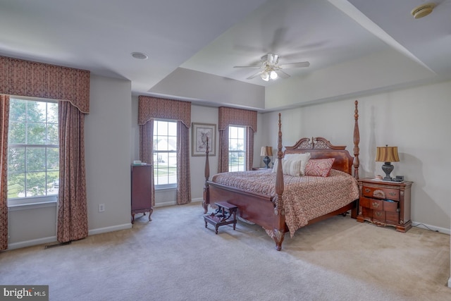 113 Anna Ct, Middletown, DE 19709 - carpeted bedroom with baseboards, a ceiling fan, a raised ceiling, and multiple windows
