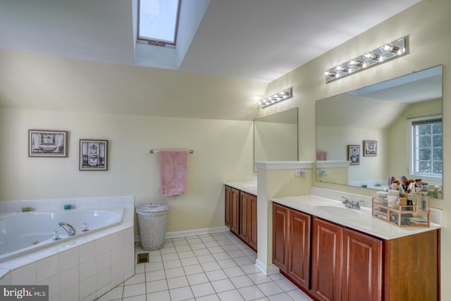 113 Anna Ct, Middletown, DE 19709 - bathroom featuring tile patterned flooring, vanity, a jetted tub, baseboards, and lofted ceiling with skylight