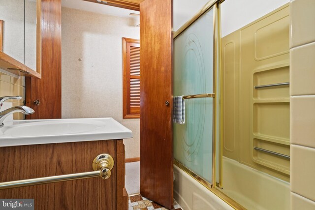 full bathroom with vanity and enclosed tub / shower combo
