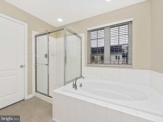 bathroom with a bath, tile patterned floors, recessed lighting, and a stall shower