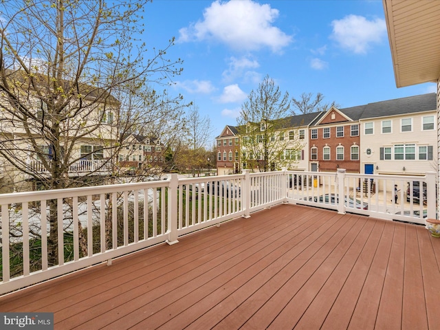 wooden deck featuring a residential view